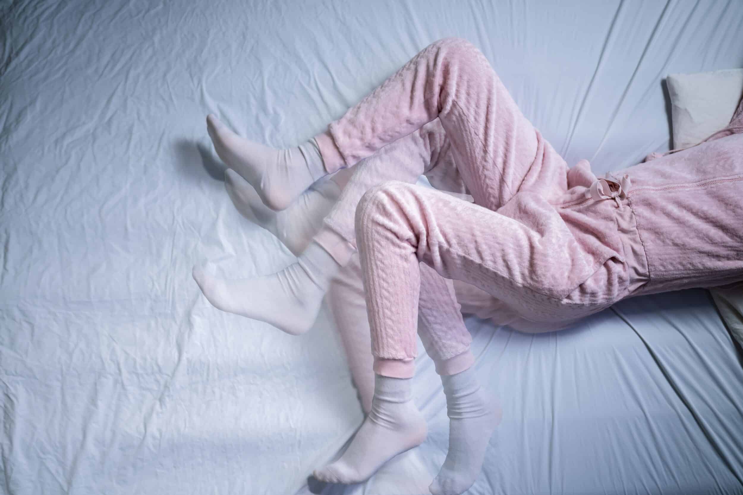 What Aggravates Restless Leg Syndrome? | Geneva, IL A person’s legs moving restlessly while they’re in bed.